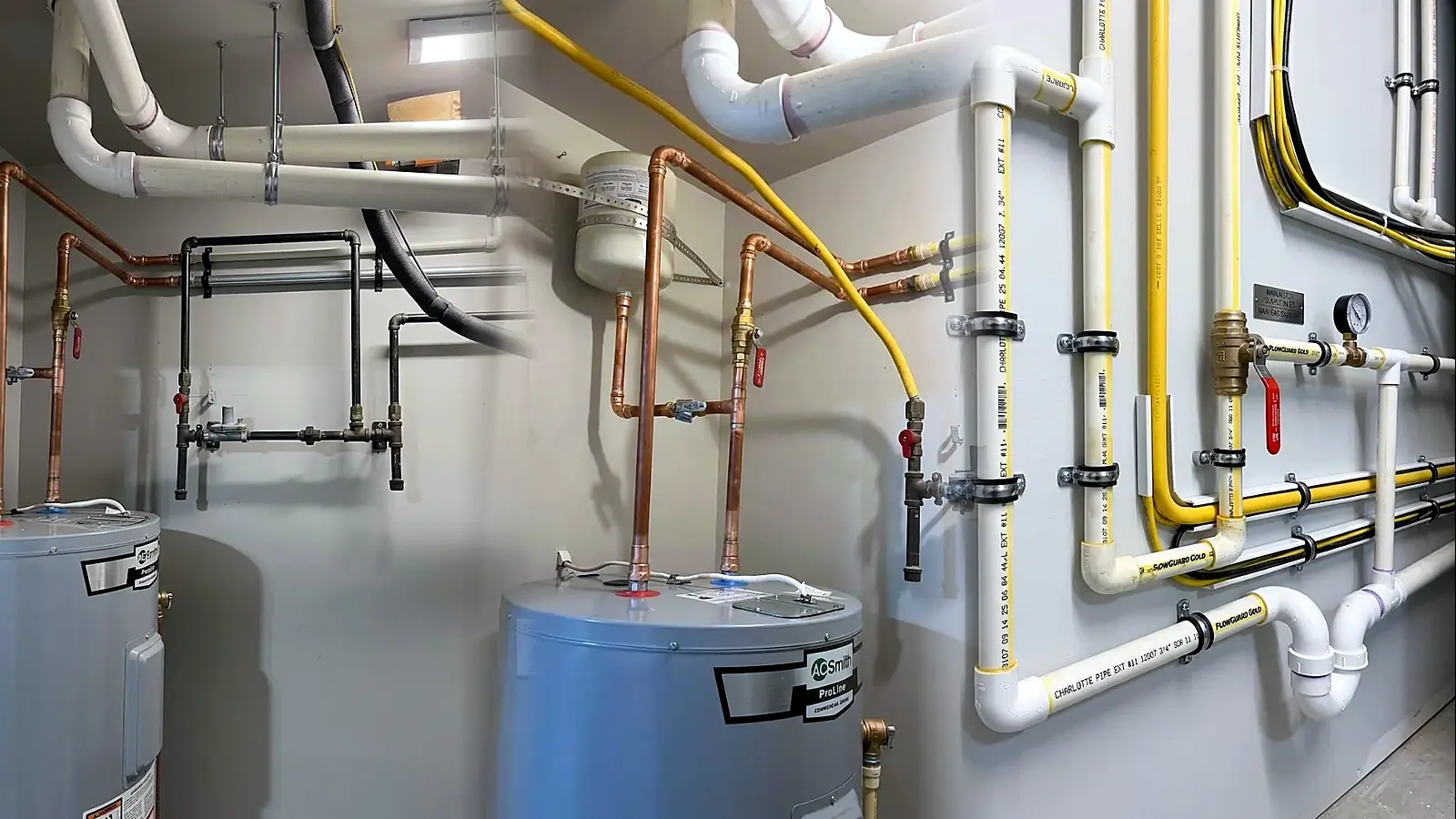 Three finished plumbing jobs side by side: new copper runs above a water heater, a heater with expansion tank and gas line, and a labeled PEX manifold