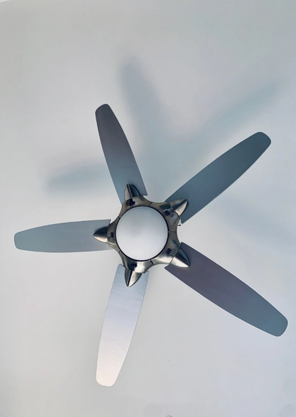 a modern five-blade silver ceiling fan with a central light fixture, professionally mounted on a white ceiling during a ceiling fan installation in vienna va.