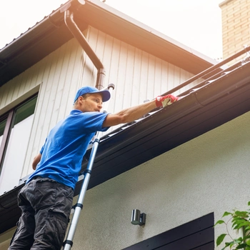 gutter repair in fairfax va performed by technician on residential home