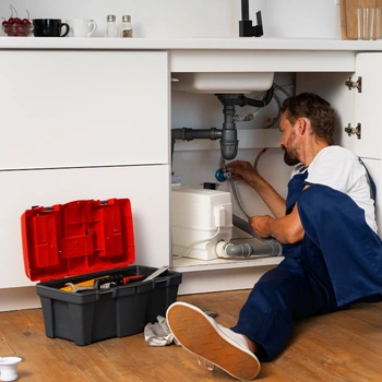 plumbing repair services in northern virginia fixing under sink pipe leak