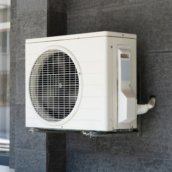 a high-efficiency white mini-split heat pump unit professionally wall-mounted on a durable bracket for a residential heat pump installation in oakton va.