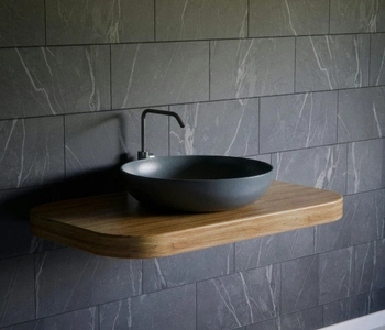 tile installers in lorton va completing modern bathroom wall tile installation with gray stone tiles and floating vanity
