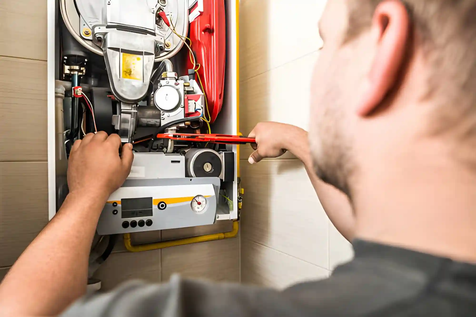 technician repairing a home heating system during residential heating repair in northern virginia.