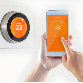 close-up of using a smartphone app to remotely control a round digital unit during a wifi thermostat installation in fairfax station va.
