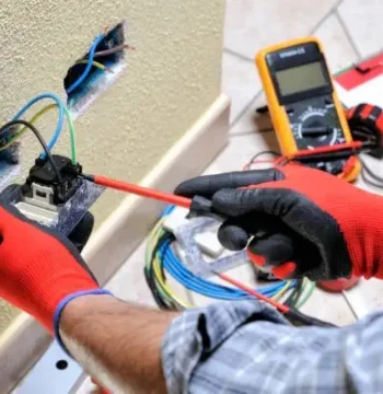 electrician in ashburn va repairing electrical outlet and wiring in residential home