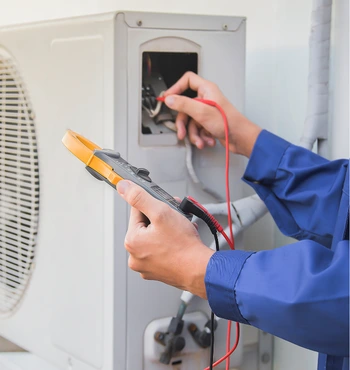 hvac services in herndon va technician testing air conditioning system performance