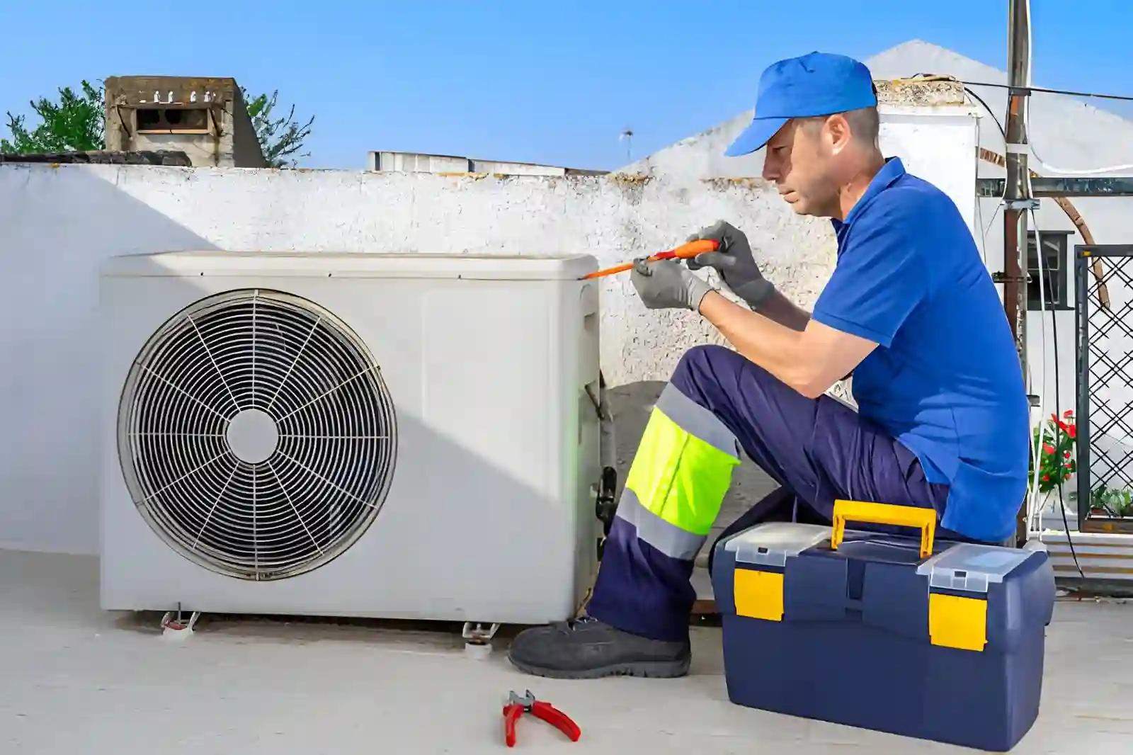 heat pump repair in centreville va with technician servicing outdoor hvac unit using tools