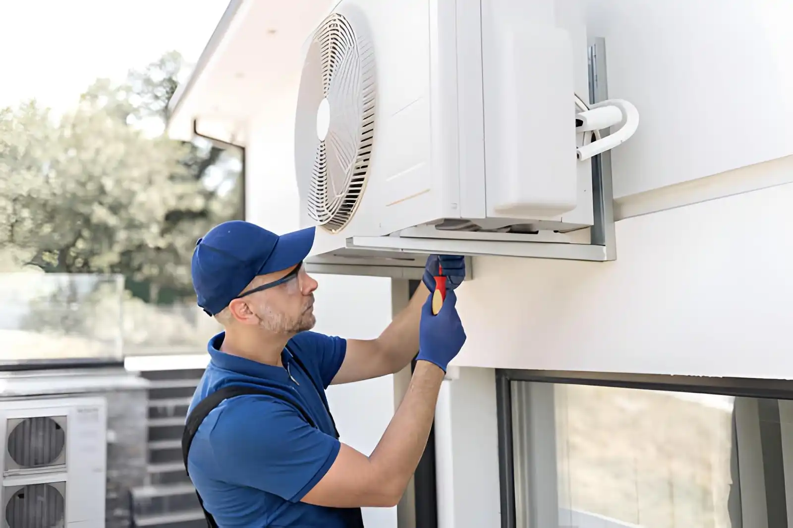 heating installation in oakton va with technician installing outdoor hvac unit for residential heating system