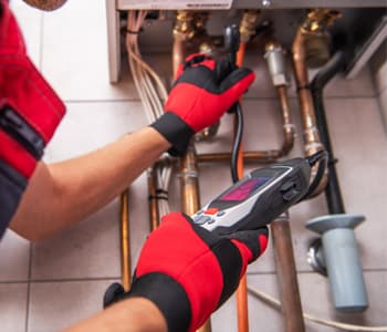 technician tracking pipe joints with an electronic scanner during a gas line repair in springfield va.