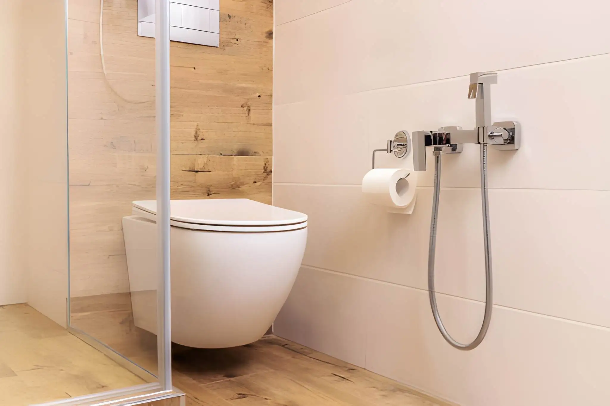 residential floating toilet installation in springfield va with custom wall tiling.