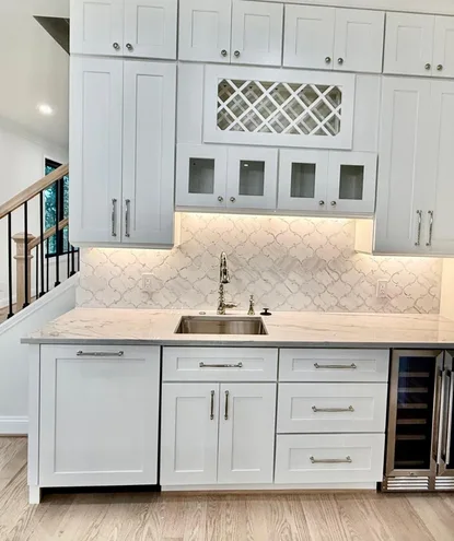 kitchen remodeling in fairfax va 2 kitchen renovation in fairfax va featuring custom beverage station, white shaker cabinets, quartz countertops, and built-in storage by sam and sons services