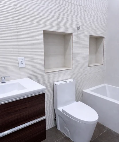 bathroom remodeling in burke va 3 premium bathroom renovations in burke, va, highlighting a large gold ceiling rain shower head system balanced with a separate handheld sprayer and natural wood vanity accents.